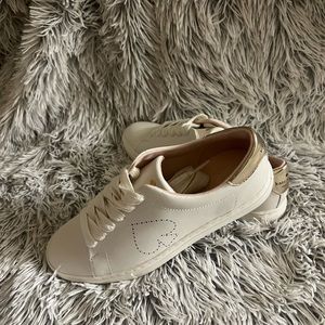 Kate Spade off white lace up sneaker with perforated heart and gold accents